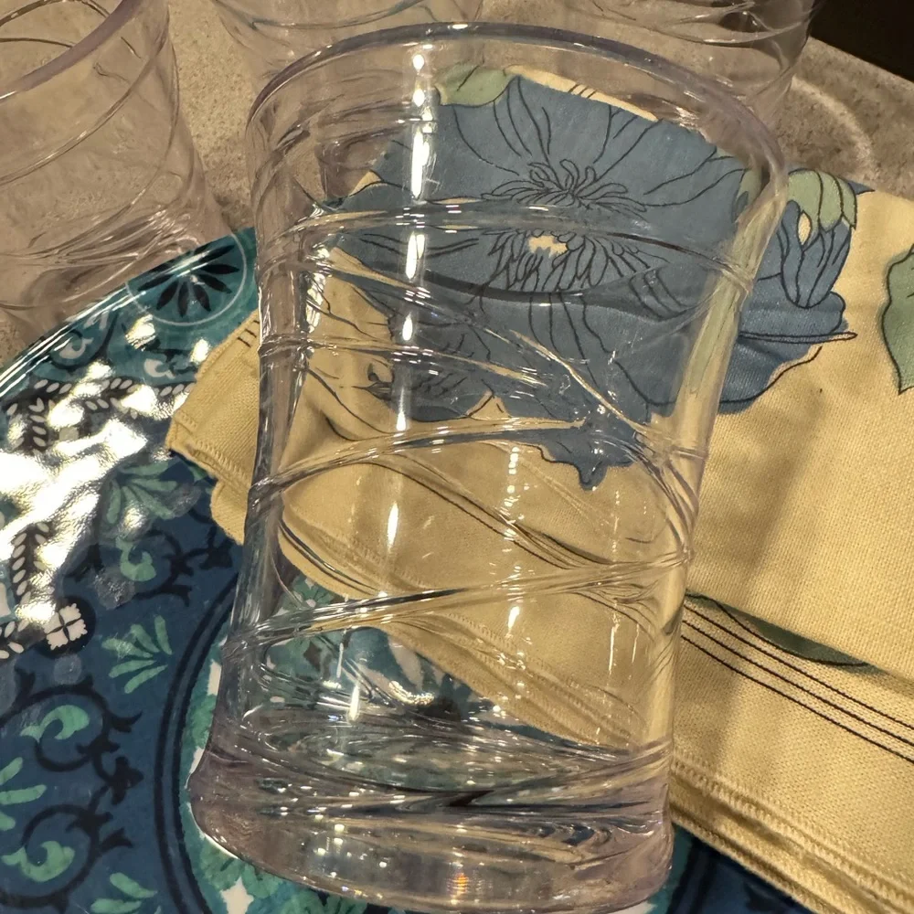 Blue Patterned Plates and Glasses with‎ Floral Napkins